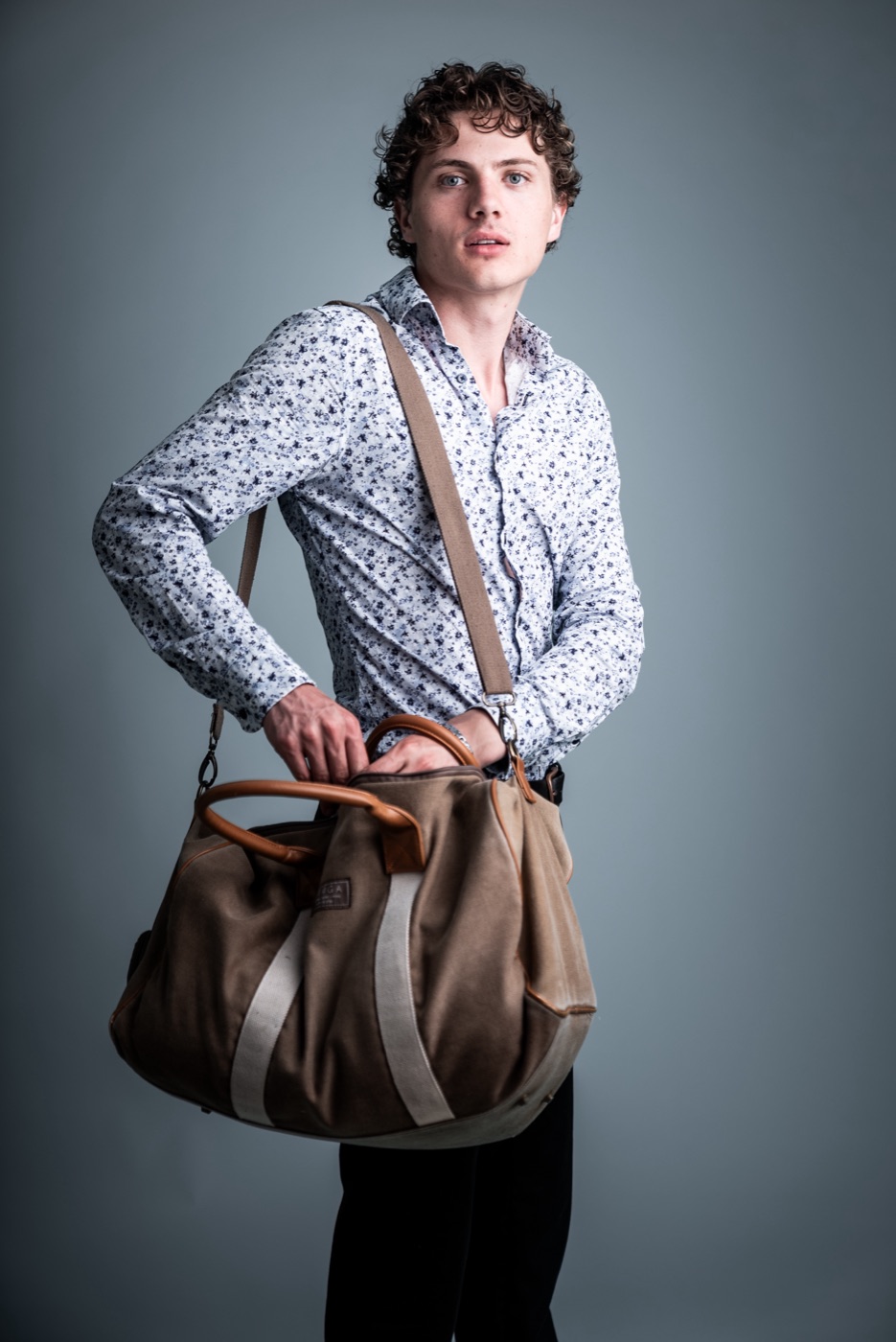 William Jannert — lifestyle portrait with a travel bag