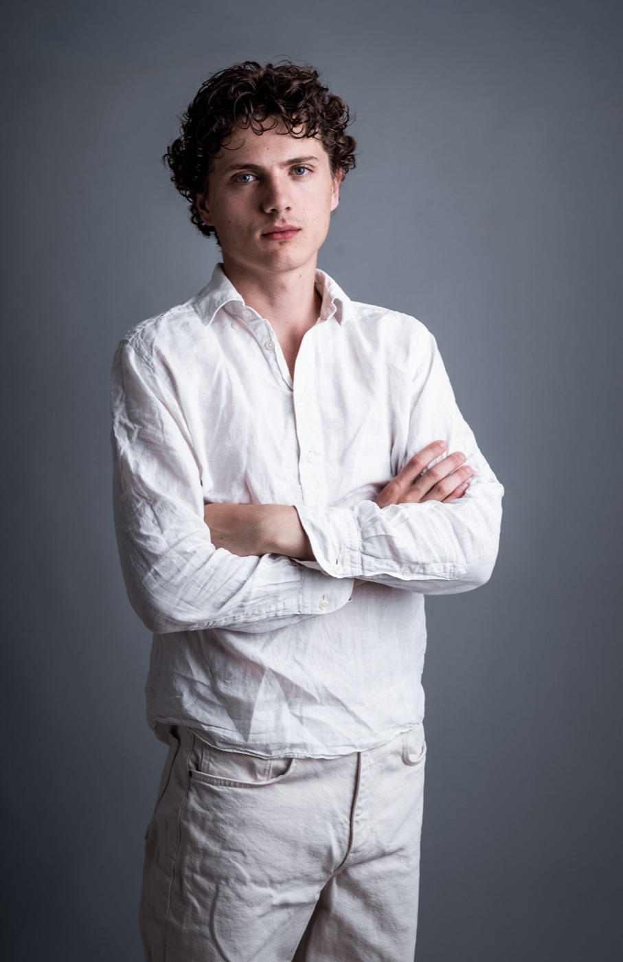 William Jannert — portrait in a white shirt, arms crossed